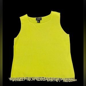 Gorgeous green sleeveless shirt with beads on the bottom.